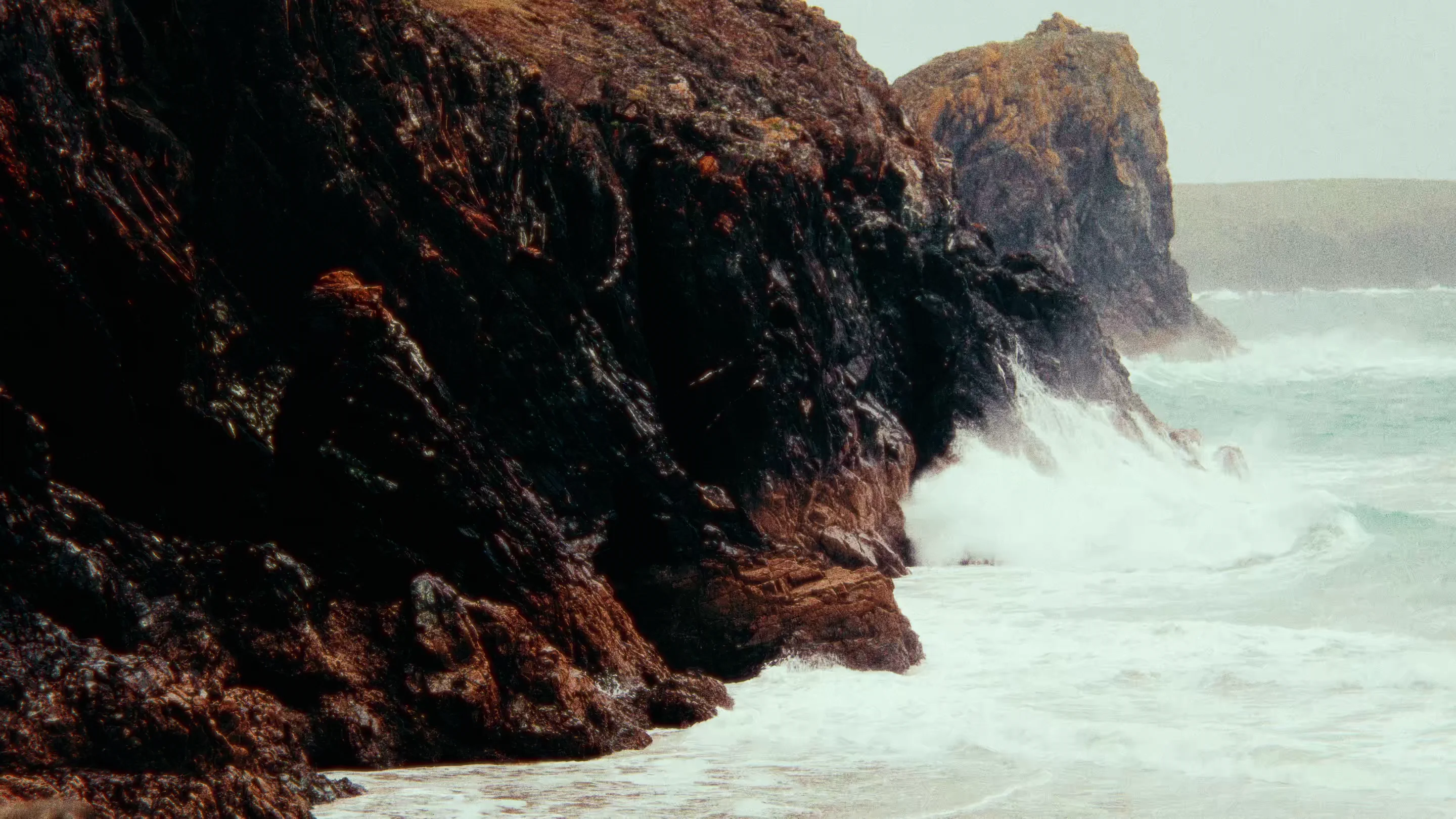 Atlantic waves breaking against the cliffs of the Cornish coast